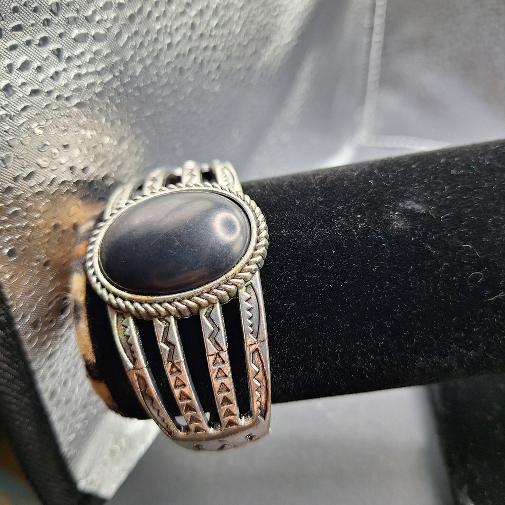 Elegant Black and Silver Bracelet with Ornate Detailing